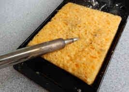 cleaning iron on moist sponge